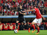 Manchester United's Armenian midfielder Henrikh Mkhitaryan (L) vies with Benfica's Portuguese defender Ruben Dias during the UEFA Champions...