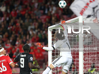 Benfica's Belgian goalkeeper Mile Svilar makes a safe during the UEFA Champions League football match SL Benfica vs Manchester United at the...