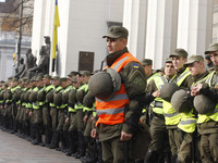 Ukrainian police and the National guard servicemen guard the entrance of the Ukrainian Parliament's building in Kiev, Ukraine, 19 October, 2...