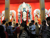 Devotee visit the puja pandal,Hindu Goddess Kali Idol at the a city Puja Pandal during Hindu festival Kali Puja and Deepawali festival on Oc...