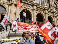 People march behind a banner as thousands gather in the streets of Lyon, France to protest against the labor law at the call of the CGT, the...