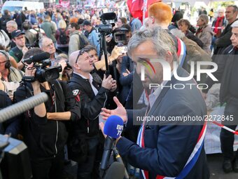 French La France Insoumise (LFI) leftist party member of parliament Alexis Corbiere (R) takes part in a demonstration called by the CGT work...