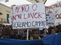 Protesters march against the G7 summit in the port of Italian island Ischia, on October 19, 2017 before the start the G7 summit of Interior...