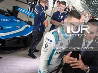 Lugi Di Maio (R) and , Sebastien Buemi (L) take a photo during a Formula E racing car press conference in Rome, Italy on October 19, 2017. R...