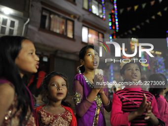 Nepalese girl singing traditional songs during Laxmi Puja as the procession of Tihar or Deepawali and Diwali celebrations at Kathmandu, Nepa...