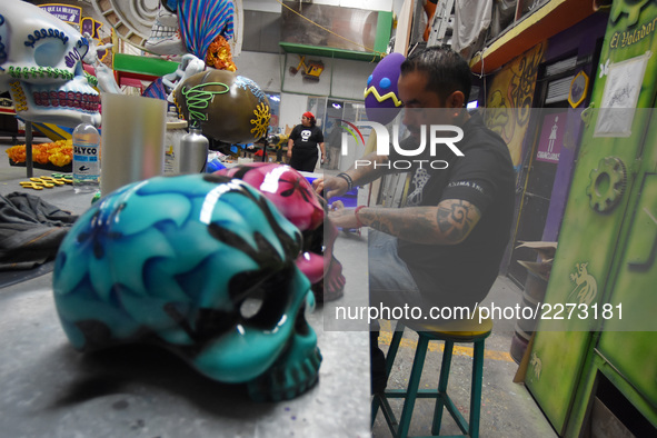 Workers of the 'Taller el Volador' made  the manufacture of skulls and catrinas that will be used for the Day of the Dead Parade inspired by...