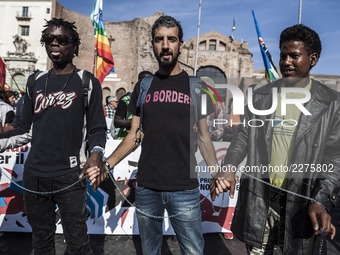 Thousands of people march downtown during the 'Non  reato' (It's not a crime) national demonstration to protest against racism and to ask ju...