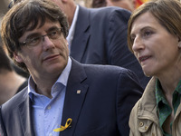 Thousands of people, led by the President of Catalonia, Carles Puigdemont, are demonstrating in Barcelona against the intervention of the Ca...