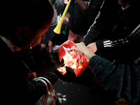 Right-wing Brazilian nationalists burn flags and pamphlets of the Workers Party (PT) in the Paulista Avenue during a right-wing nationalist...