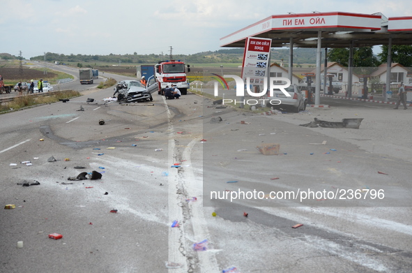 Policemen and investigators observe a car crash incident with a Germany, France and Bulgarian cars as two Bulgariand  died and four other pe...