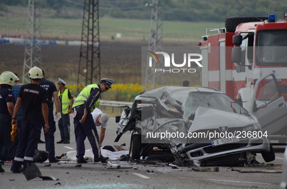 Policemen and investigators observe a car crash incident with a Germany, France and Bulgarian cars as two Bulgariand  died and four other pe...