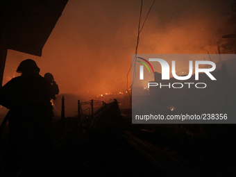 Firefighters try to contain a major fire that struck a slum located in the Campo Belo neighborhood on the Journalista Roberto Marinho Avenue...