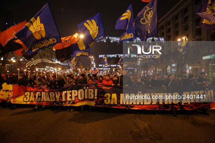 Supporters and members of different far right nationalistic movements and parties participate an annual torch march downtown Kyiv confined t...