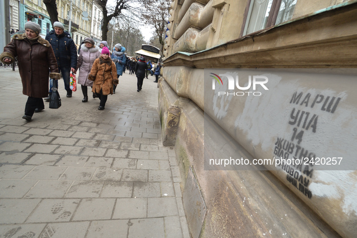 People pass by UPA march graffiti seen in Lviv's city center.
On Friday, January 12, 2018, in Lviv, Lviv Oblast, Ukraine. (Photo by Artur Wi...