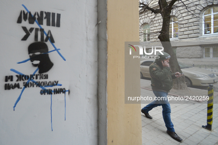 A man passes by UPA march graffiti seen in Lviv's city center.
On Friday, January 12, 2018, in Lviv, Lviv Oblast, Ukraine. (Photo by Artur W...