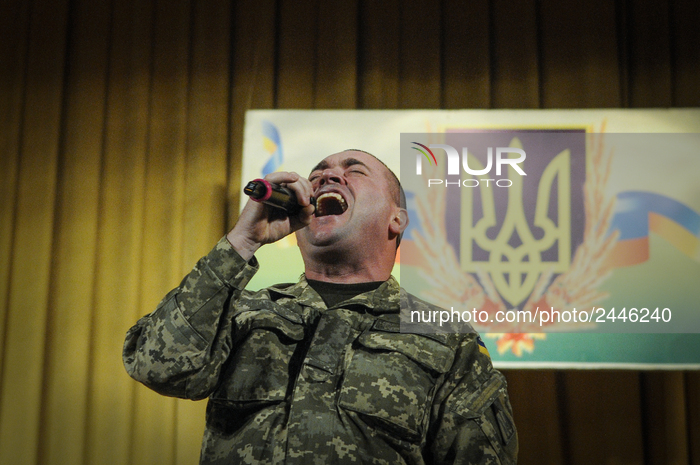 A member of the armed forces is seen performing a rock song in the officers club in Vinnytsia, Ukraine on January 25, 2018. (Photo by Jaap A...