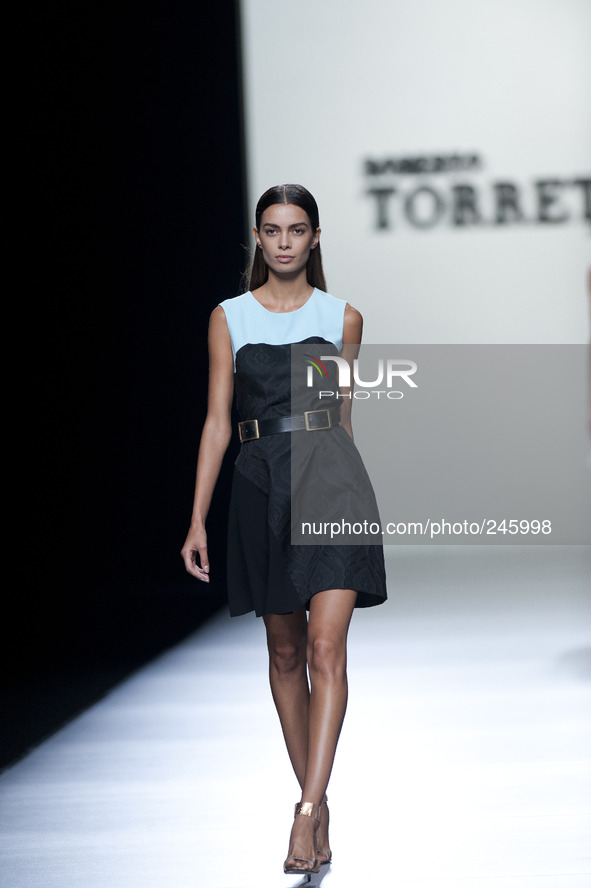 Model parades a design Roberto Torretta, during the 60th Mercedes-Benz FashionWeek Madrid (MBFWM) in Madrid, Spain, 13 September 2014. 