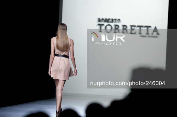 Model parades a design Roberto Torretta, during the 60th Mercedes-Benz FashionWeek Madrid (MBFWM) in Madrid, Spain, 13 September 2014. 