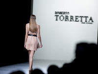 Model parades a design Roberto Torretta, during the 60th Mercedes-Benz FashionWeek Madrid (MBFWM) in Madrid, Spain, 13 September 2014. (