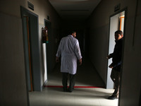 A Palestinian A doctor while walking in the corridor of Al-Durra Hospital in Gaza City, February 8, 2018(