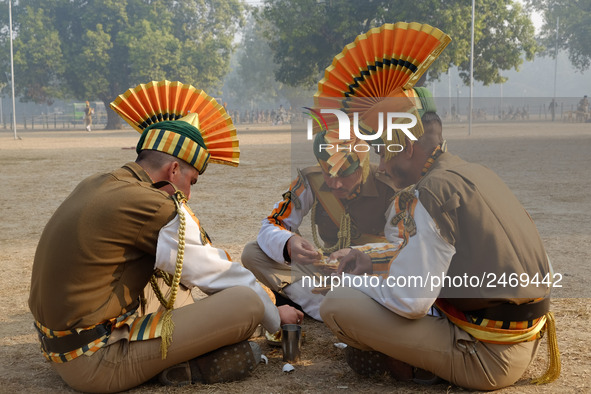 Indo-Tibetan Border Police (ITBP) soldies eat breakfast after rehearsing for the upcoming 69th Republic Day Parade in New Delhi on January 1...