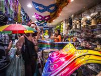 People observe the masks of an ornaments shop, prior to the celebration of the Carnival, in Sao Paulo, Brazil, on February 9, 2018. Accordin...
