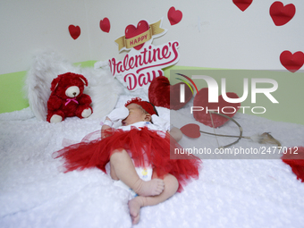 A newborn dressed in Valentine's Day Hearted Costume at Paolo memorial hospital in Bangkok, Thailand, February 12, 2018. (