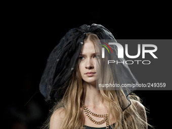 A model displays a creation by Spanish fashion label Waverley during the Samsung EGO fashion show at the Mercedes-Benz Fashion Week Madrid o...