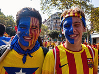 National Day of Catalonia, youth with his face painted with the 