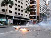 Riot police fire tear gas in an attempt to disperse people after an eviction ended in violent clashes in downtown Sao Paulo, Brazil on Septe...