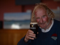 A local man enjoys his pint of Guinness in Cleggan's Pub. Connemara, County Galway, Ireland. Photo: Artur Widak /NurPhoto (