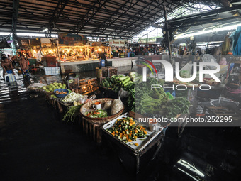 Vegetable and meat stalls are seen submerged in flood water caused by tropical storm Fung Wong inside a wet and dry market in Manila, Philip...