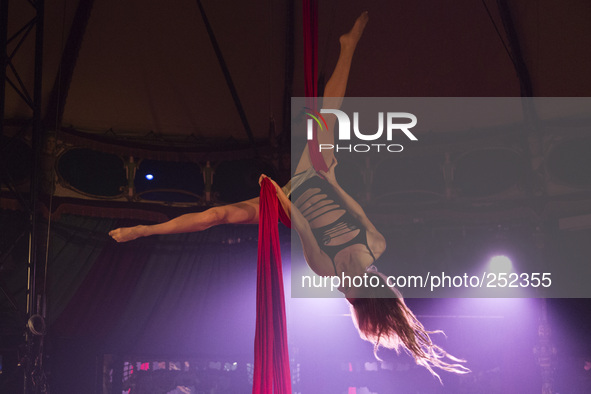 London, UK. 18 September 2014. AirCraft Circus presents Twilight Circus at Canary Wharf's Spiegeltent. The group AirCraft Circus is based in...