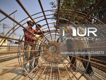 Migrated workers from India working at on-going Bridge expansion work supported by China AID at Tinkune, Kathmandu, Nepal on Thursday, March...