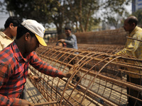 Migrated workers from India working at on-going Bridge expansion work supported by China AID at Tinkune, Kathmandu, Nepal on Thursday, March...
