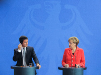 German Chancellor Angela Merkel and the French Prime Minister Manuel Valls talk to the media after their meeting in the Chancellery on Septe...