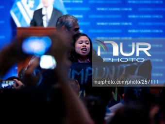 NEW YORK - A member of a militant group disputes President Aquino's speech in the World Leaders Forum in Columbia University on September 23...