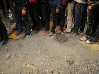 Foots of Nepalese Youths seen as line up to pay the amount for the application submission for the Korean Language Test (KLT) under the Korea...