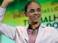 The presidential candidate Marina Silva, of the Brazilian Socialist Party (PSB), raises her fist during a meeting with union leaders during...
