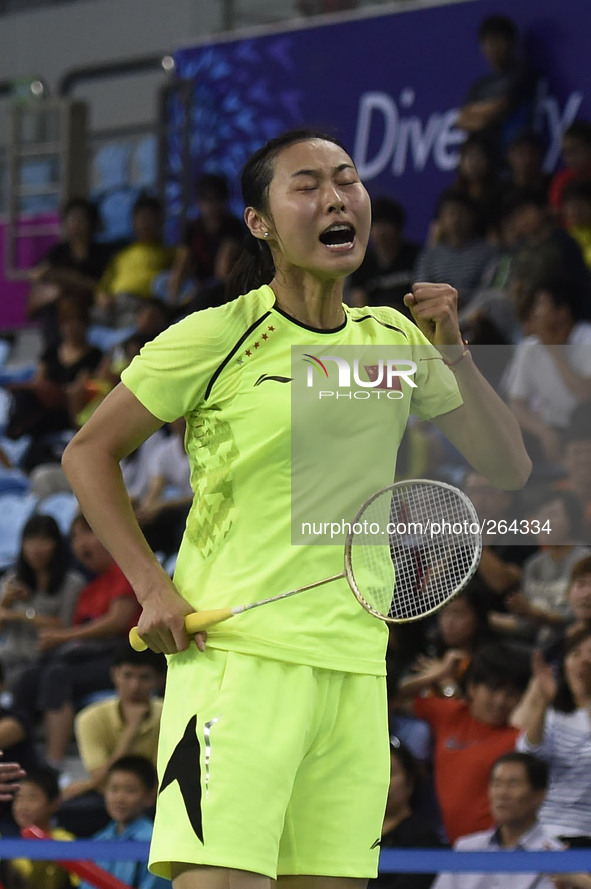 (140928) -- INCHEON, Sept. 28, 2014 () -- Wang Yihan of China celebrates during the women's singles final of badminton against her teammate...