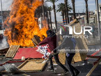 View of a fire during clashes following a May Day march in Santiago on May 1, 2018.  The clashes between demonstrators and carabineros of th...