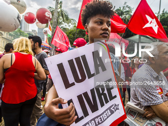 Supporters of the Workers' Party founder and Brazilian ex-president (2003-2011) Luiz Inacio Lula da Silva take part in a May Day rally at Re...