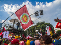 Supporters of the Workers' Party founder and Brazilian ex-president (2003-2011) Luiz Inacio Lula da Silva take part in a May Day rally at Re...