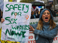 A young woman holds 'Safety for Sex Workers Now!' sign during an annual May Day march for workers' rights.
On Tuesday, May 1, 2018, in Dubli...