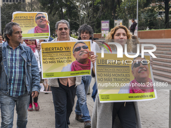 People with posters, asking for the release of Jesus Santrich, member of the FARC-EP, on Labor Day in Bogotá, Colombia, on May 1, 2018. (