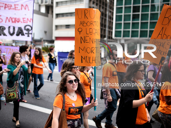 Protestors hold placards during a demonstration in favor of the legalization of abortion in Sao Paulo, Brazil on Sept. 28, 2014. Abortion is...