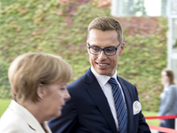 Angela Merkel, German chancellor, welcomes the  Prime Minister of Finland, Alexander Stubb, with military honors at the German chancellery o...