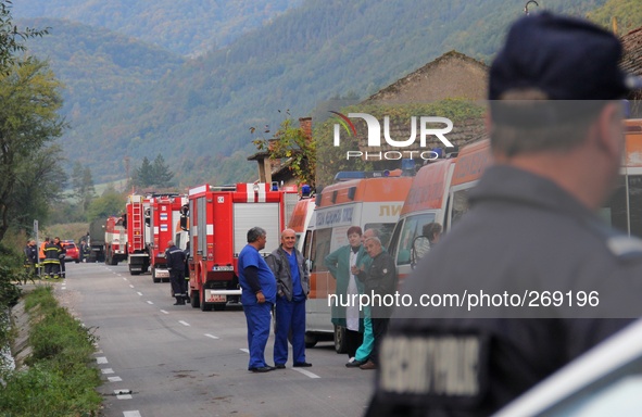 Bulgarian policemen, firemen and medical crew attend in a 4 kilometers away secure zone from a scene of blast at Explosives Plant