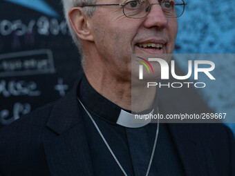 The Archbishop of Canterbury, Justin Welby during his visit to Belfast, stops at the Peace Wall. Belfast, Nortern Ireland. 2nd October 2014....