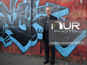 The Archbishop of Canterbury, Justin Welby during his visit to Belfast, stops at the Peace Wall. Belfast, Nortern Ireland. 2nd October 2014....